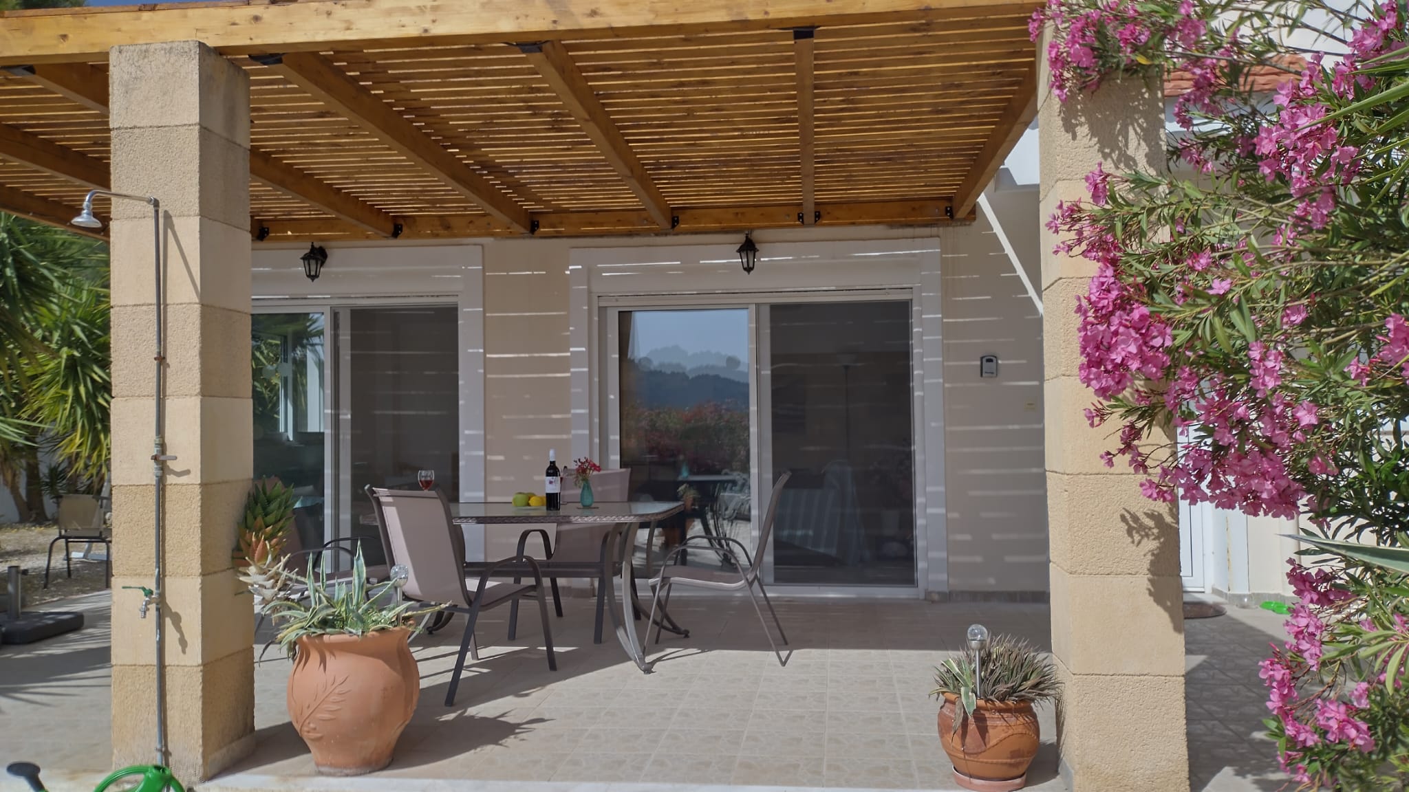 Terrace front side under pergola Villa Odysseus Rhodes